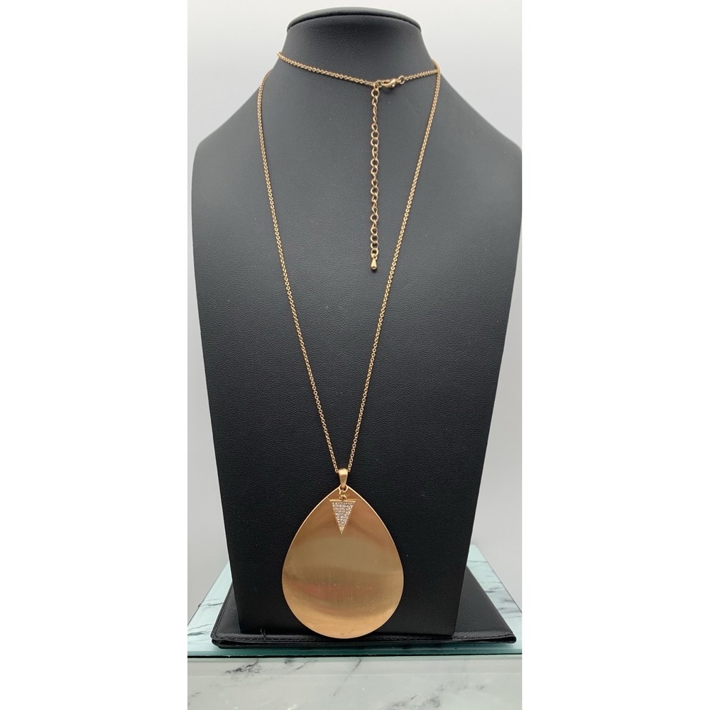 Gold Tone Necklace With A Large Brush Gold Tone Tear Drop Rhinestone Pendant
